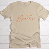 Beiges Damen T-Shirt Brustdruck "Bride" als personalisiertem Spruch als Hochzeitsgeschenkidee von Love & Faith