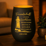 Graviertes Freundschafts-Windlicht schwarz-gold mit Leuchtturm und Namen von Love & Faith